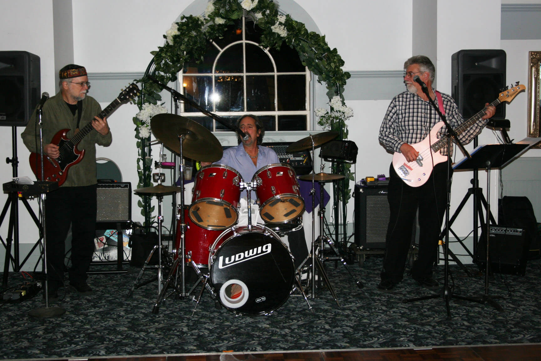 Saturn and the Outer Planets entertain with their music, led by astrologer Bruce Scofield (on the left).