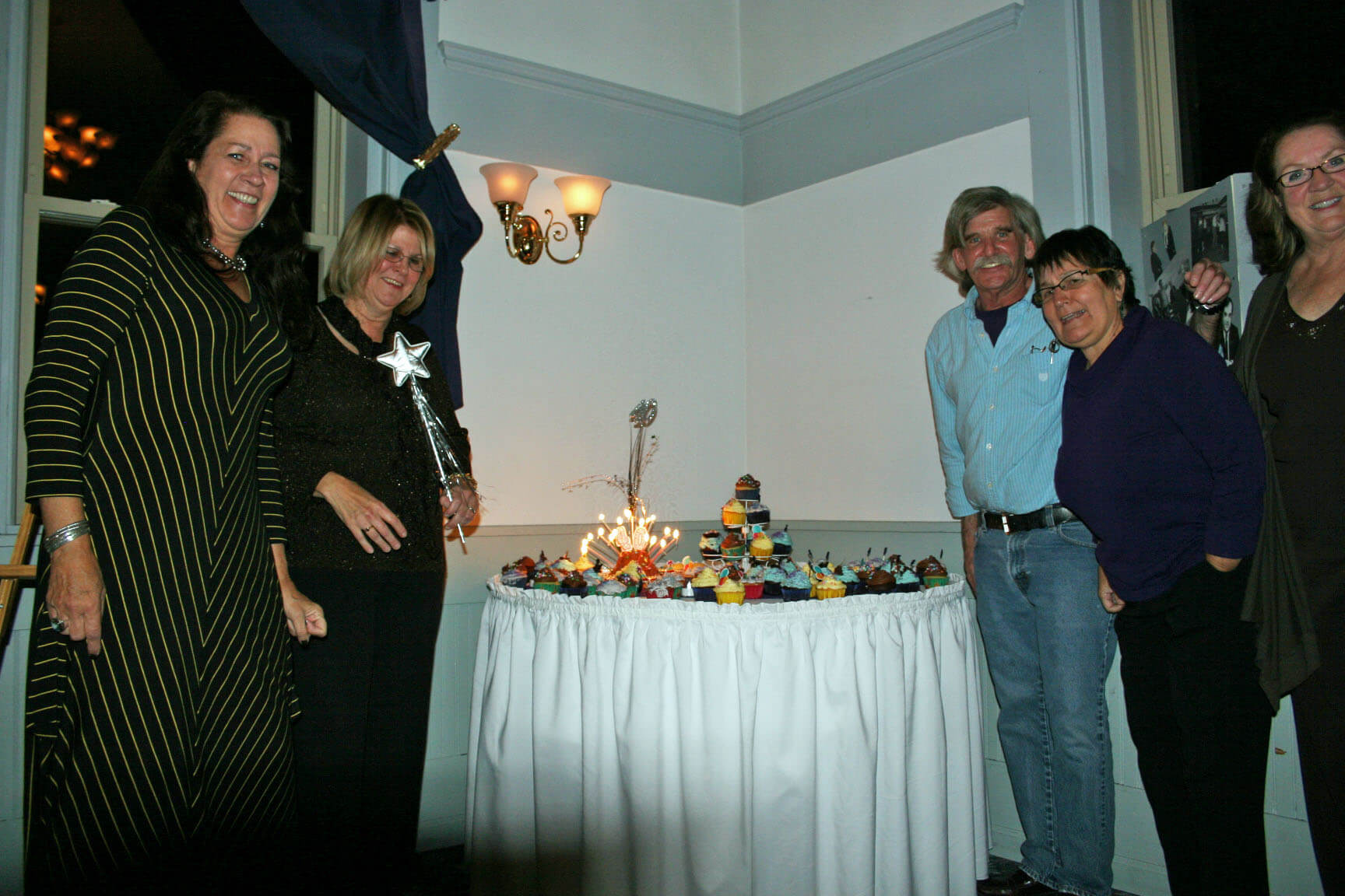 (left to right) Agneta Borstein, Debby Vincelett, Charlie Edgarton, Yvonne Goshdigian and Sandra Pease check out the array of cupcakes.